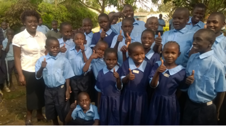 Children receiving new school uniforms