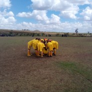 Lemuguru Eton 1 Girls team share some encouraging words before the game begins